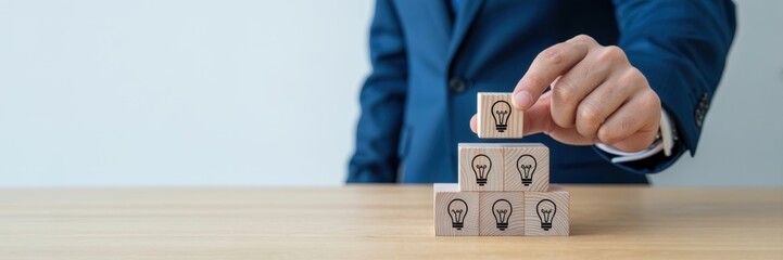 Idea creation and innovative product launching concept. Wooden block with rocket and idea generation icons. Idea creation, innovation and the launch of a new product from concept to execution.