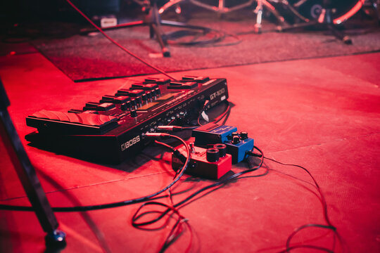 Lviv, Ukraine &ndash; February 24, 2019: Close-up of a musician&rsquo;s pedalboard BOSS GT-100 on stage during the concert.