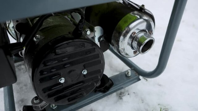 A gasoline generator vibrates as the engine works.
