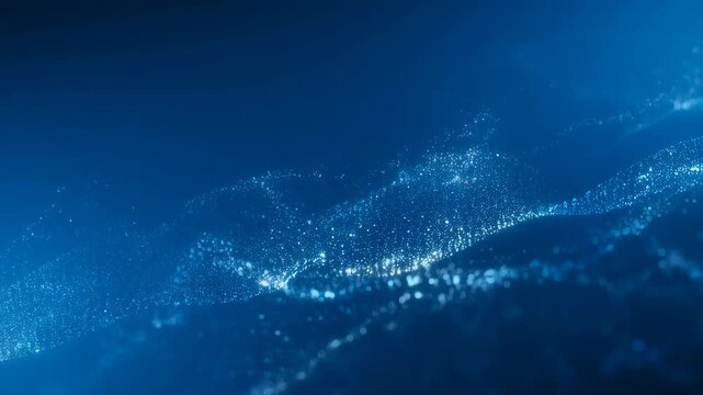 Abstract blue wave with sparkling particles creating a mesmerizing underwater effect. Ideal for backgrounds in technology and digital themes