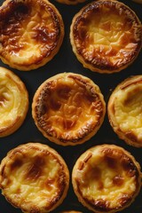 Portuguese Custard Egg Tarts : A close-up, top-down view of pastel de nata