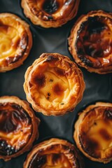 Portuguese Custard Egg Tarts : A close-up, top-down view of pastel de nata