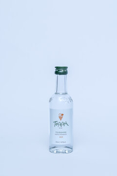Miniature bottle of traditional Greek grape marc spirit Tsilili Tsipouro without anise. 50ml sampler bottle with green cap isolated on white background. Ukraine, Zhytomyr, January 03, 2026