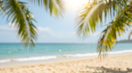 Fototapeta premium Blurred view of a tropical beach with palm trees and blue ocean on a sunny day