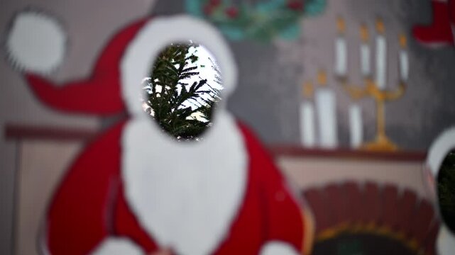 Festive Christmas stand-in board featuring Santa Claus with face cut out