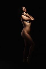 Fototapeta premium Beautiful nude woman posing on black background, space for text