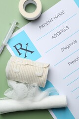 Fototapeta premium Flat lay composition with medical prescription form on green background