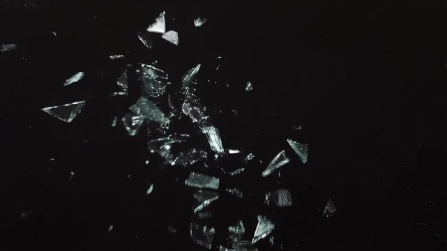 Glass shattered into pieces over black background video animation, glass explosion