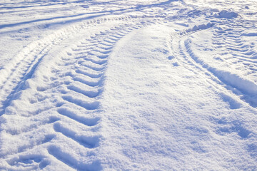 Car tire tracks in the snow. Background