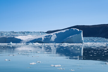 Iceberg Reflections in Front of Eqi Glacier, Disko Bay, Greenland © Michel