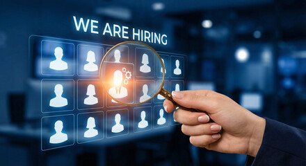 Corporate Recruitment and Talent Acquisition Concept with Hand Using Magnifying Glass to Select Ideal Candidate on Digital Holographic Interface