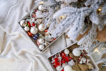 Christmas Ornaments Under Snow-Covered Tree Overhead
