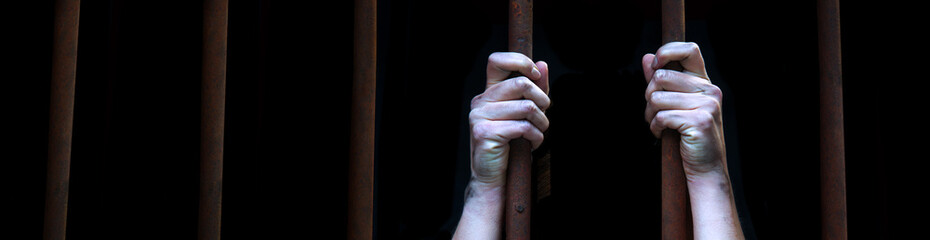 Sad young girl in prison