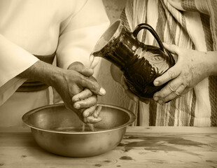 Woman pour water on hands