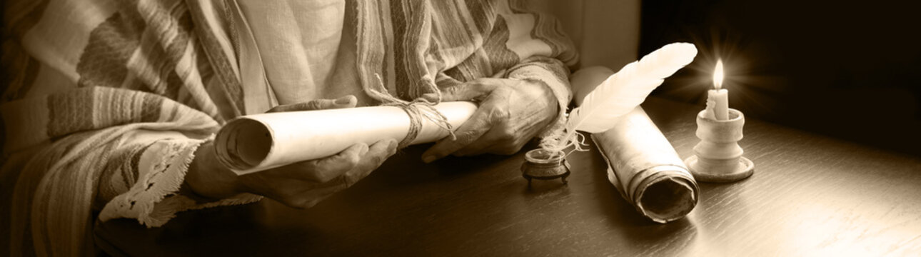 Man holding an old scroll