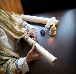 Man holding an old scroll