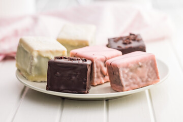 Sweet dessert cake. Mini pie on plate on white table.