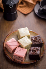 Sweet dessert cake. Mini pie on plate on wooden table.