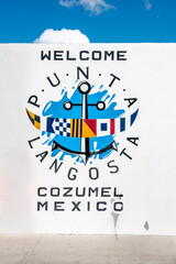 Welcome sign for Punta Langosta in Cozumel Mexico near the water