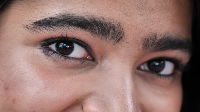 Bangladeshi girl's captivating brown eyes with kohl eyeliner looking at viewer