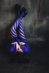 Body positive concept. Sexy elegant beautiful gorgeous self confident plus size middle age woman in a violet suit and tights