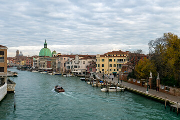 Venice Grand Canal with San Simeon Piccolo church and a boat, in