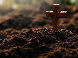 A cross planted in the ground, representing a Christian grave marker or memorial.
