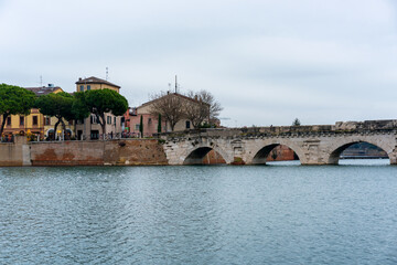 Obraz premium Tiberius ancient roman bridge spanning Marecchia river in Rimini