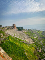 Ascending the Steepest Theater of Eumenes II amidst Lush Pergamon Acropolis Slopes