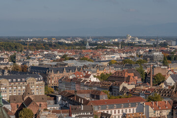 View from balcony of cathedral in Strasbourg, with buildings and sky in background