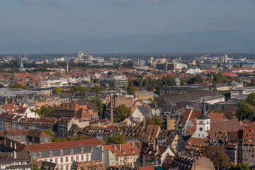 View from balcony of cathedral in Strasbourg, with buildings and sky in background