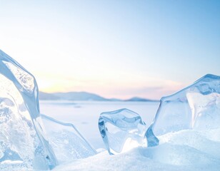 Beautiful large crystal clear ice pieces sparkle on a fresh blanket of white snow, showcasing a tranquil winter landscape featuring a frozen lake and majestic mountains under a soft pastel sky at dawn