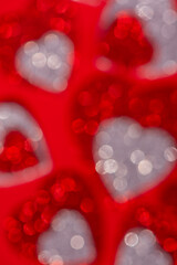 Abstract blurred background of sparkling Hearts. Good for Valentines day greeting card, social media post or advertising design background