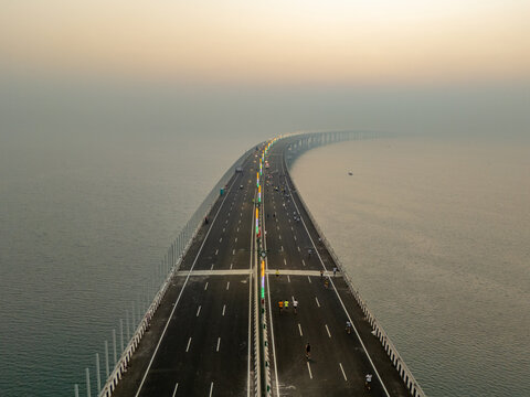 Aerial view of the Bandra-Worli Sea Link stretching across the hazy Arabian Sea, a modern marvel against the skyline, Mumbai, Maharashtra, India.
