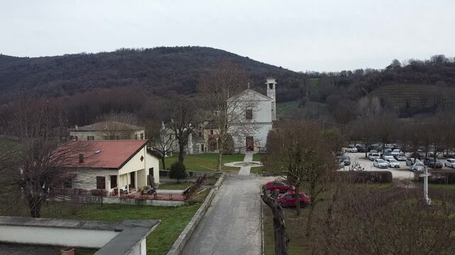 Aerial view of the historic Santa Maria Assunta Church, known as La Rotonda, in Rezzato, Italy. Ancient Romanesque architecture in the Valverde valley, Brescia province.