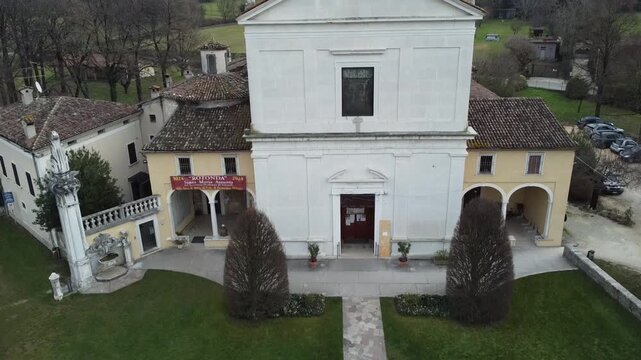 Aerial view of the historic Santa Maria Assunta Church, known as La Rotonda, in Rezzato, Italy. Ancient Romanesque architecture in the Valverde valley, Brescia province.