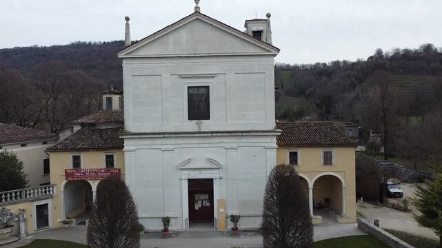 Aerial view of the historic Santa Maria Assunta Church, known as La Rotonda, in Rezzato, Italy. Ancient Romanesque architecture in the Valverde valley, Brescia province.