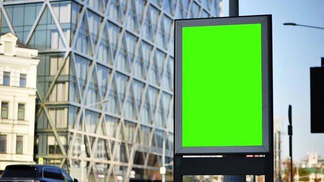 Urban street advertising billboard with blank green screen mockup for promotion