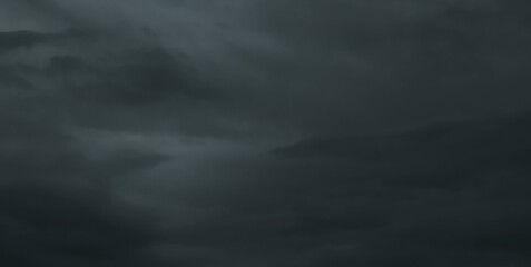 Dark storm sky with dramatic fluffy clouds. Cloudscape rainy season. Thunderstorm climate weather. Pollution smoke PM 2.5 Cabo dioxide concept. Scary Halloween.