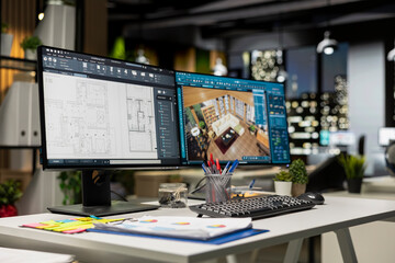 Contemporary office desk with CAD interface displaying digital blueprints and 3D renders of architectural projects. Ideal for architecture and construction professionals engaged in planning.