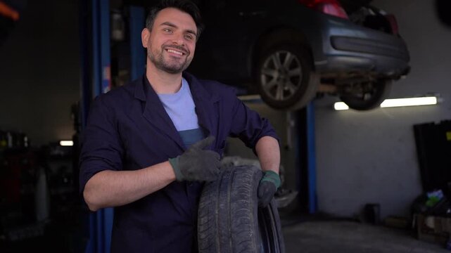 Mechanic repairs tire inside garage for vehicle maintenance on a sunny day