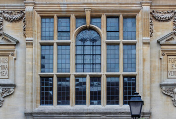 Beautiful stained glass window and antique stucco work on the building.