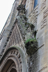 Wesley Memorial Church, a Methodist church in central Oxford. Tympanum above the entrance, decorated with stone carvings. Oxford, United Kingdom.