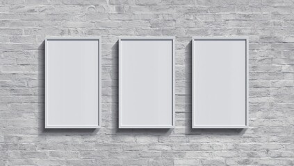 mockup of three tall vertical rectangular frames with thin white borders, aligned side by side on a white brick wall 