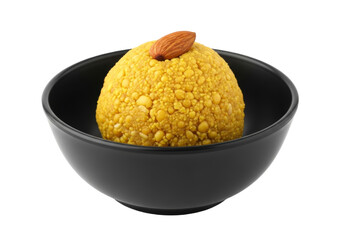 golden besan laddu in black bowl with almond garnish