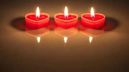 Three heart shaped candles burning brightly on reflective surface