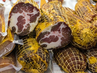 Homemade cured pork dry neck capicola meat sold on a market outside