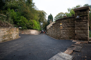 asphalt driveway at a old stone house 