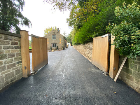 asphalt driveway at a old stone house 