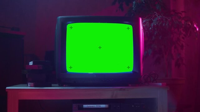 Close-Up of Dated TV Set with Green Screen Mockup, Retro 90s Technology Concept